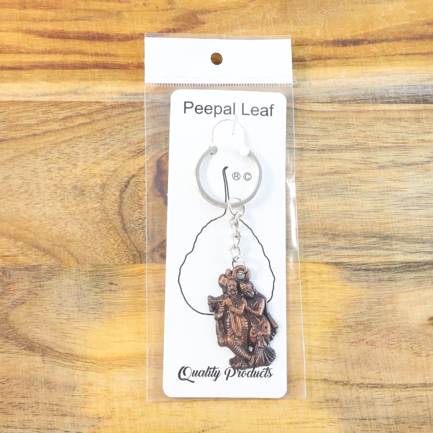 High-quality metal Radha Krishna keychain showcasing fine details