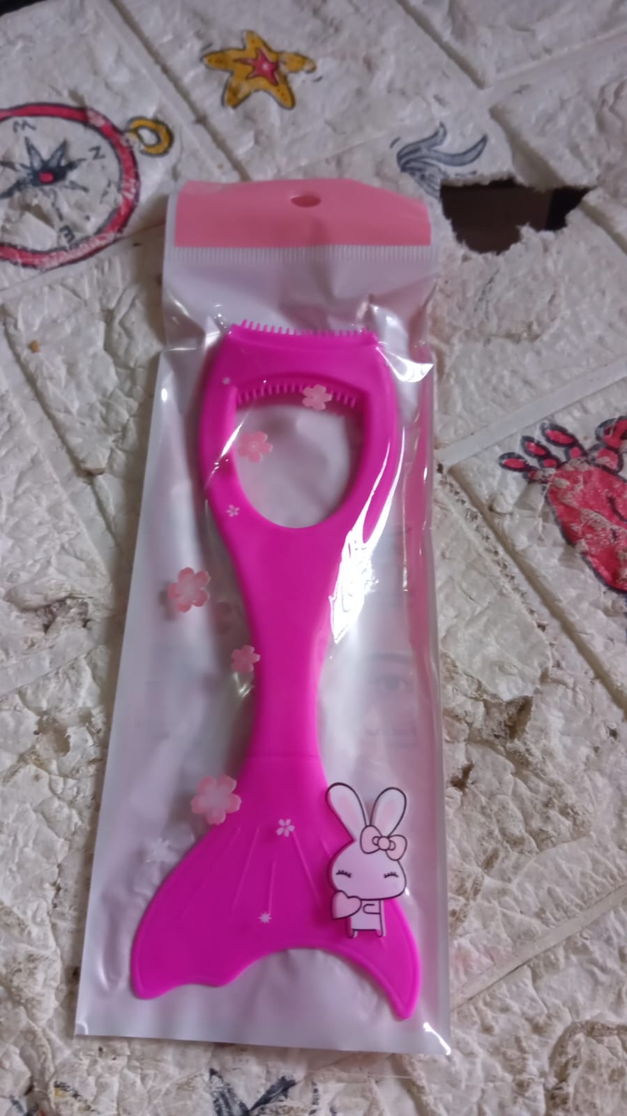 The versatile silicone eyeliner tool showcased alongside various makeup products.