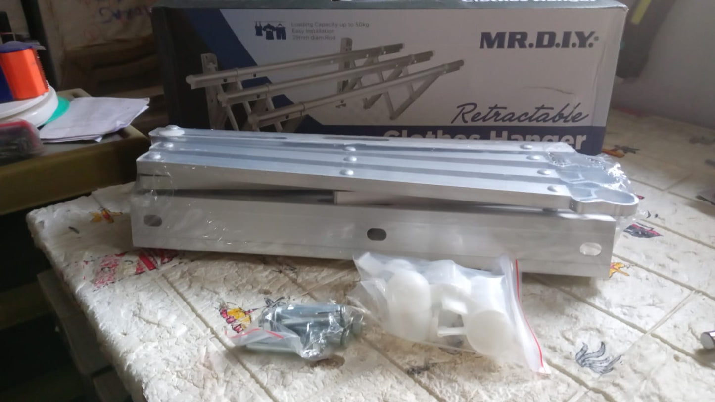 Partially folded clothes rail demonstrating its flexibility and ease of use.