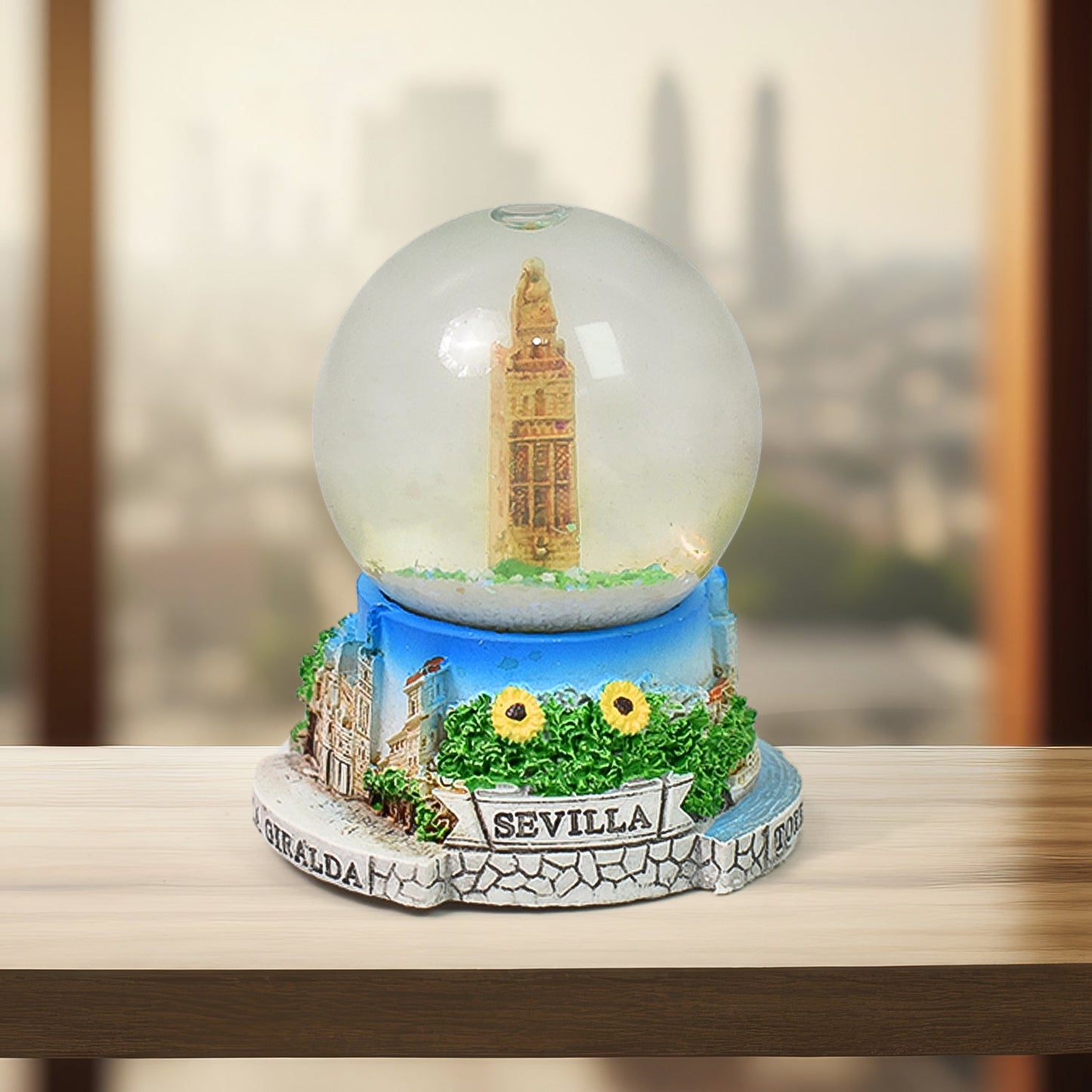Front view of the decorative snow globe, showcasing its clear dome and base.