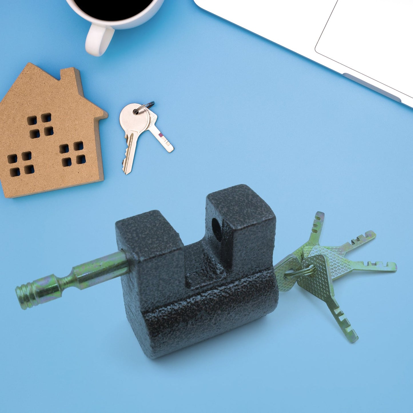 Set of five keys attached to the durable black iron door lock, ready for immediate use.