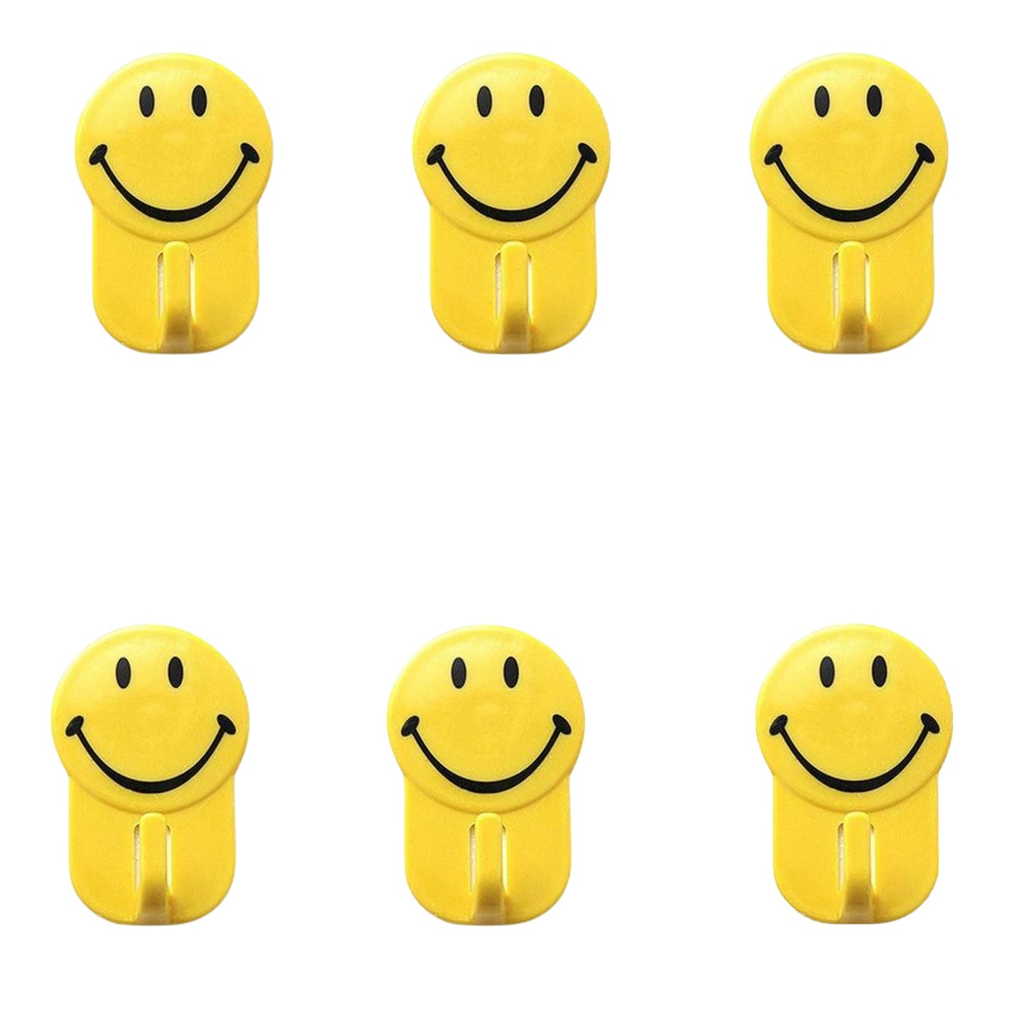 Close-up of a plastic smiley face hook demonstrating its self-adhesive backing.