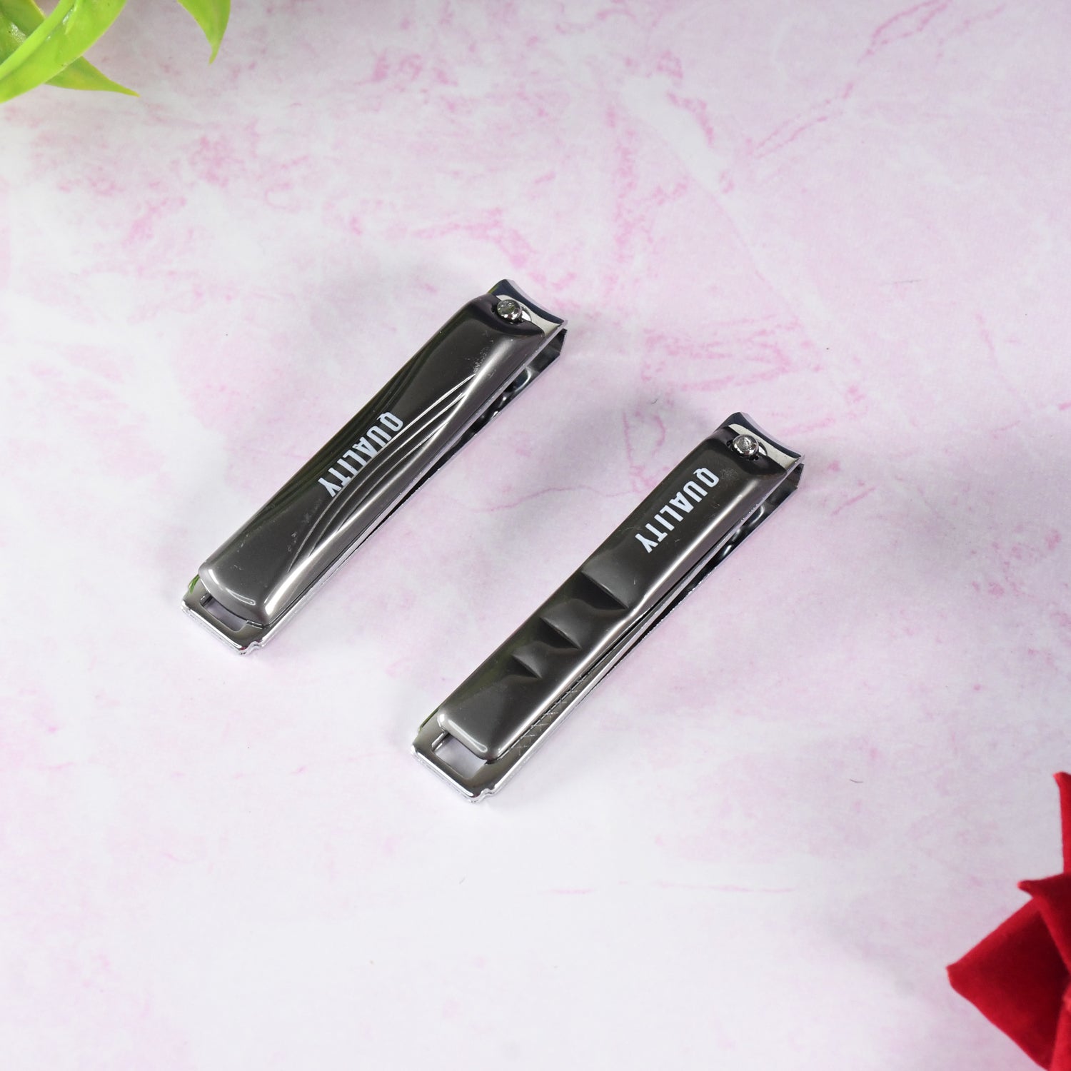 Nail clipper cutting fingernail with sharp blades for precise trimming