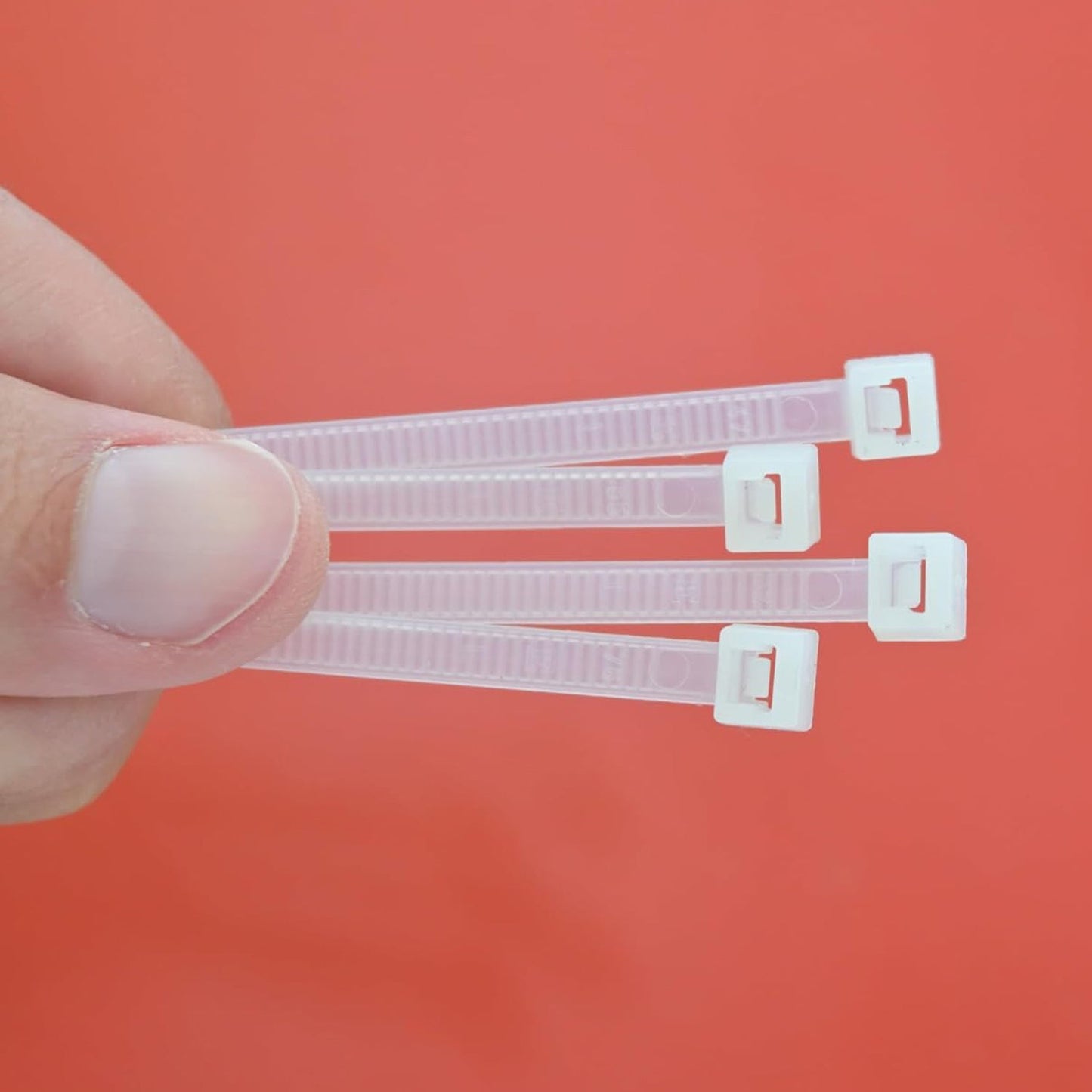 Bundle of 100 black 10-inch nylon cable ties, ideal for heavy-duty cable management.