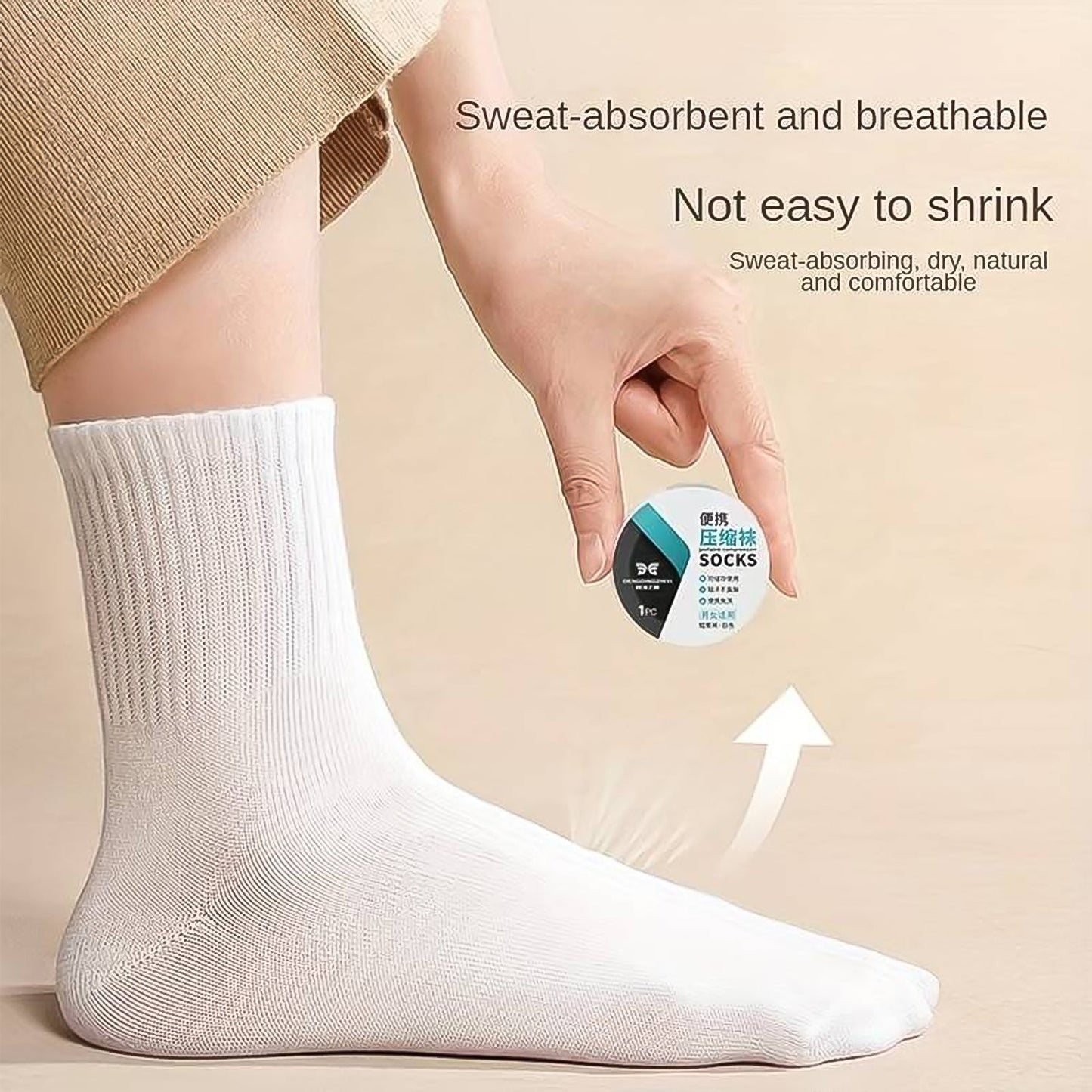 A pair of compact, white disposable travel socks for easy packing.