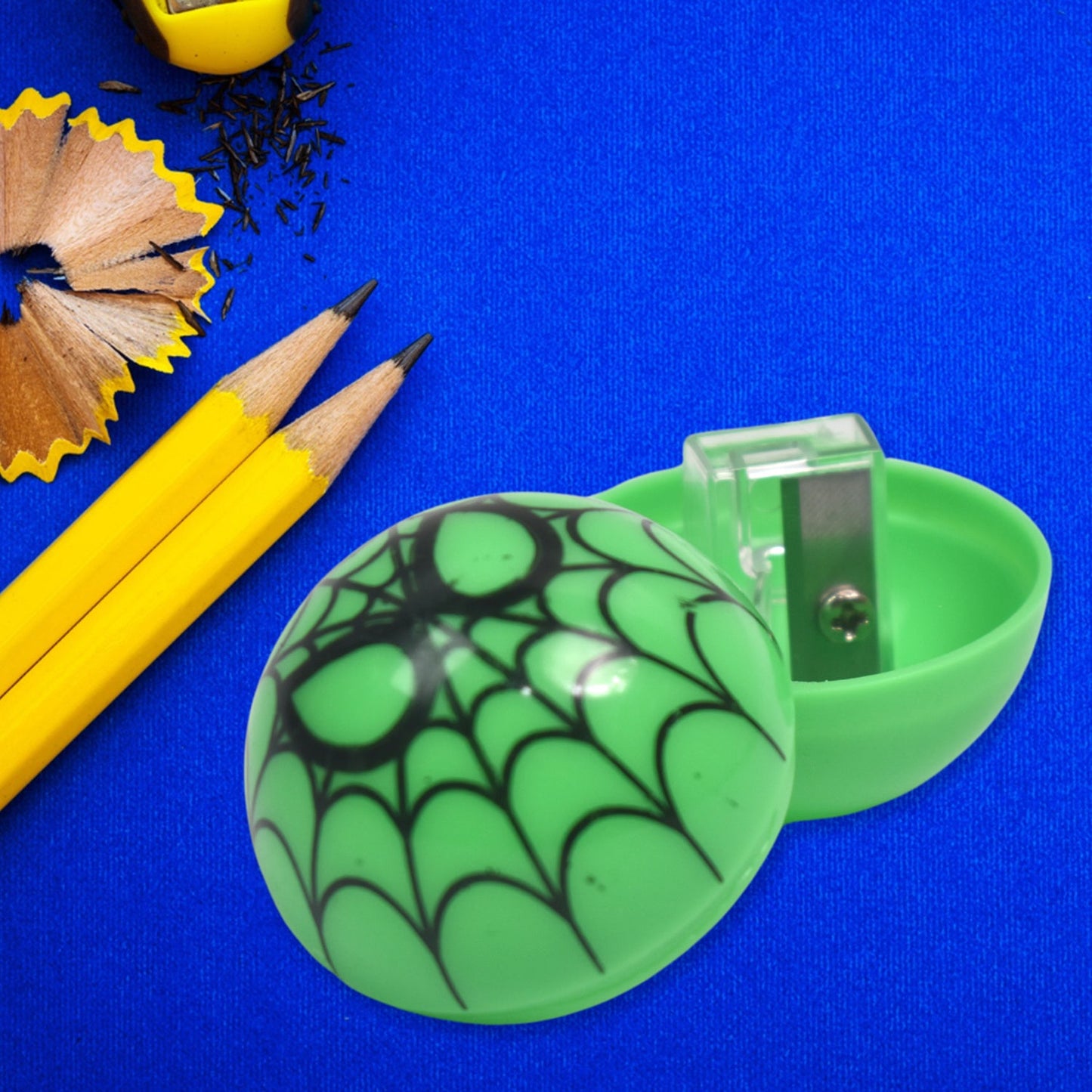 Colourful round pencil sharpener featuring cute cartoon patterns for children.