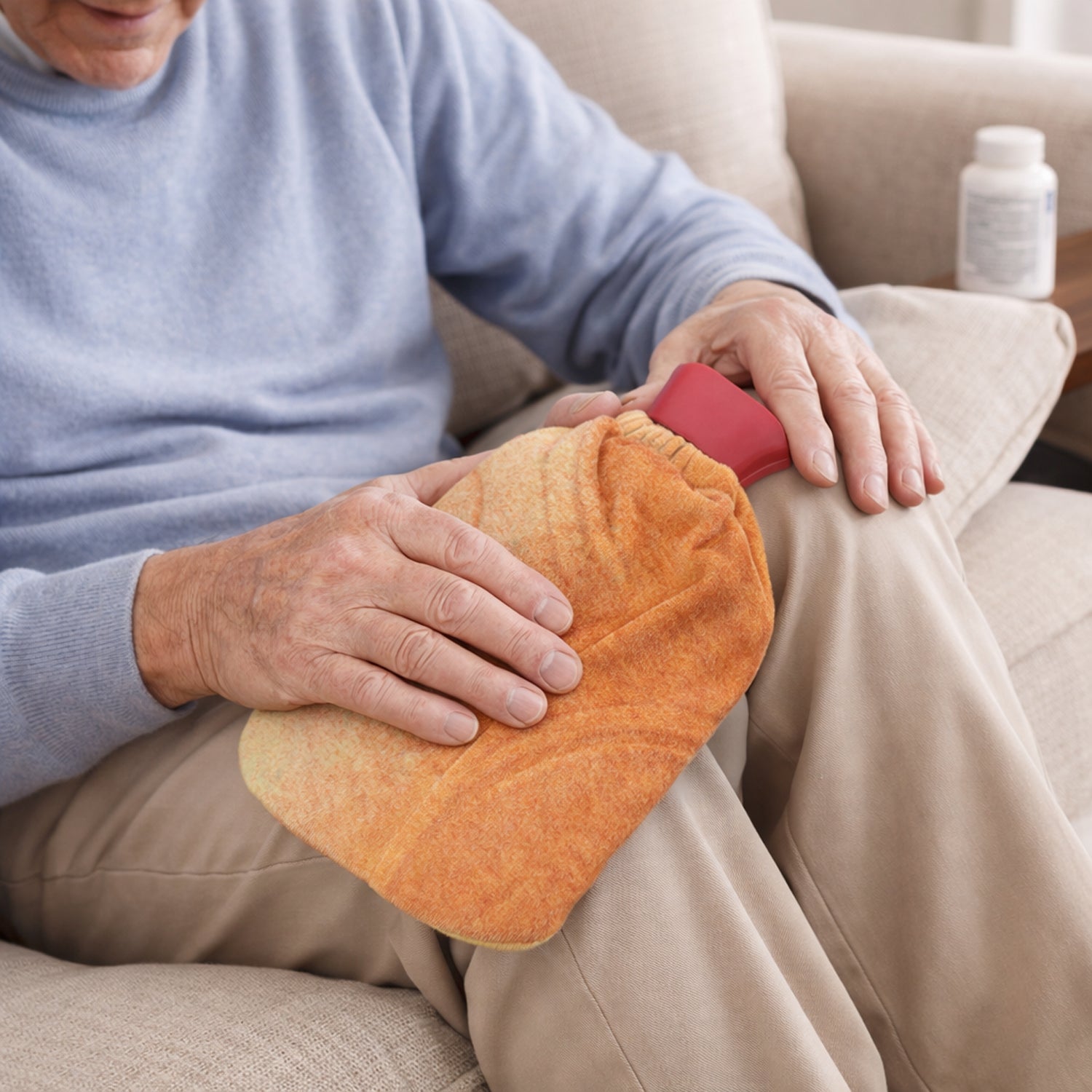 Heat therapy reusable hot water bag wrapped in soft protective fabric cover
