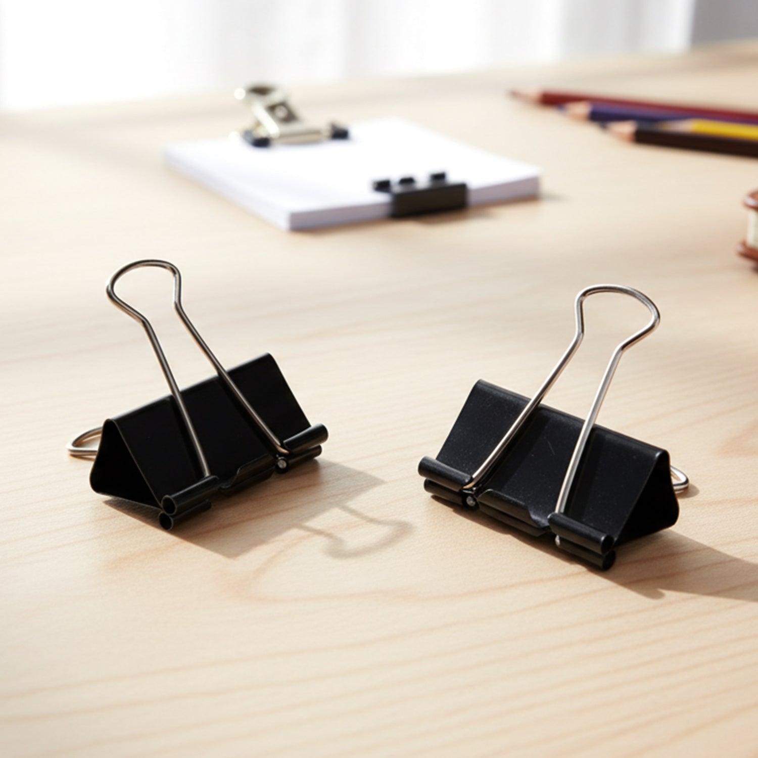 Metal binder clip with easy press handles for quick release