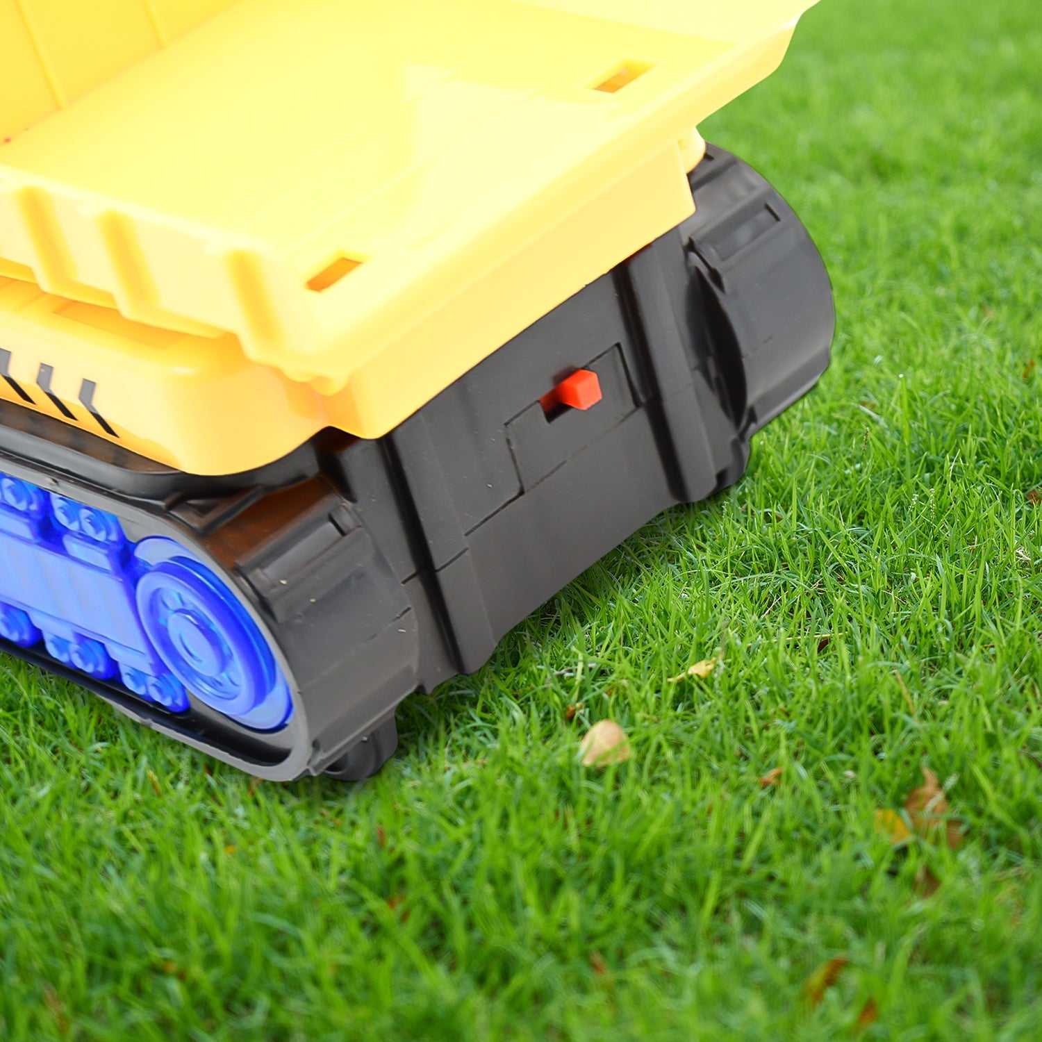 Top-down perspective of the yellow dump truck toy, showing its full design.