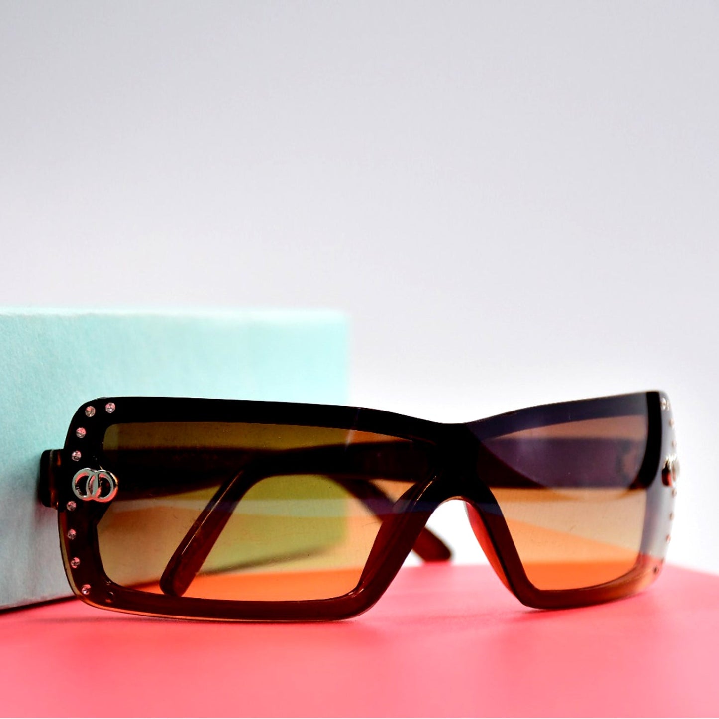 Retro Driving Sunglasses with golden vintage fashion frame on a white background.