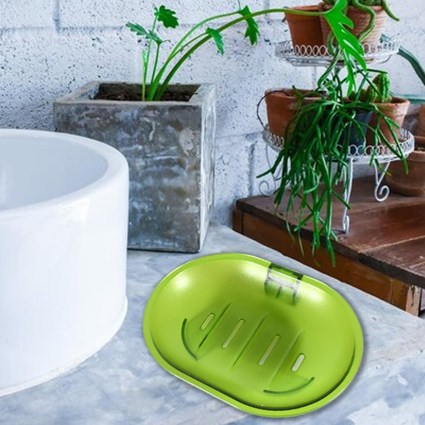 White plastic soap dish holding a bar of soap in a clean bathroom.