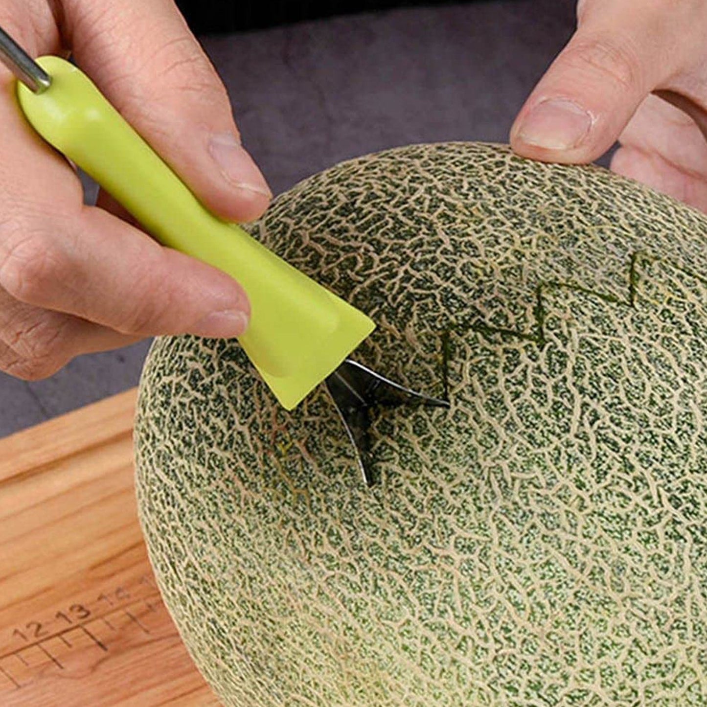 Using the fruit baller to create perfect spheres from a fresh watermelon.