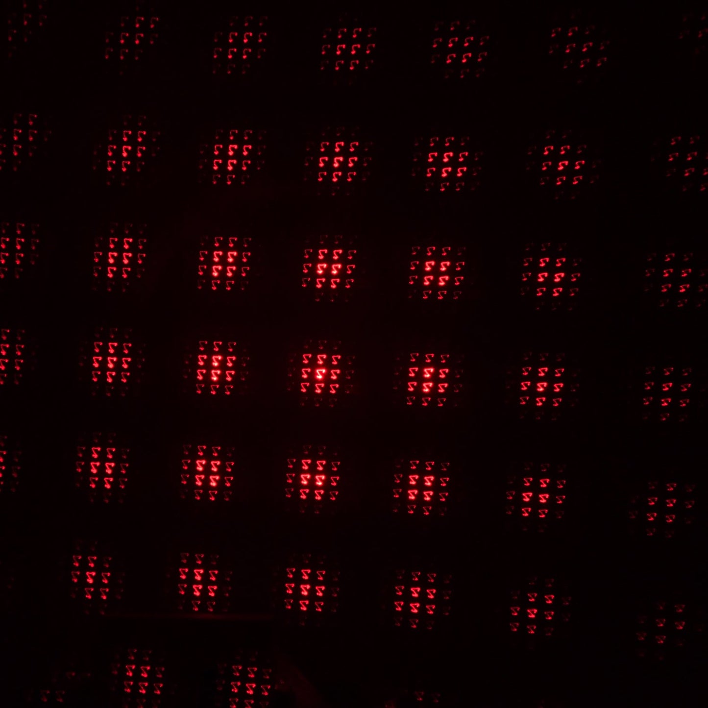 A galaxy projector creating a romantic starry night effect in a dimly lit room.