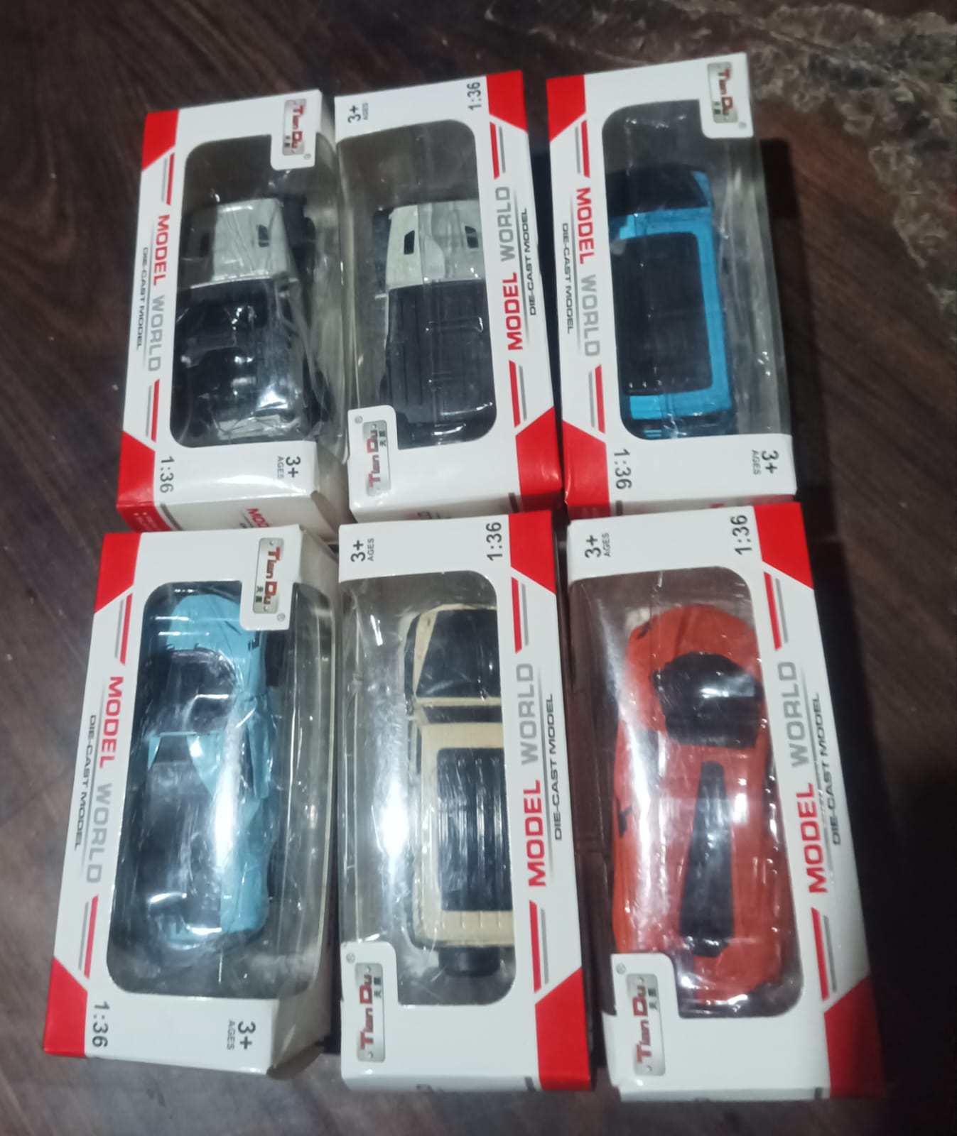 Detailed view of the wheels and vibrant design on a pull back car toy.