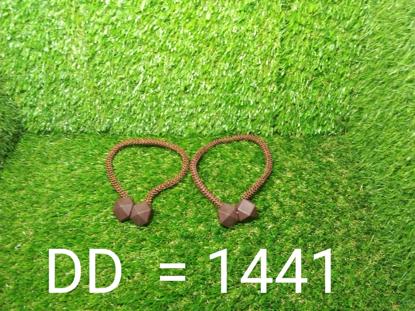 Two magnetic curtain buckles with braided rope, perfect for easy window styling.
