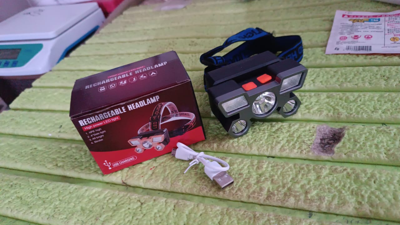 Person wearing the 5 LED headlamp during a night outdoor activity.