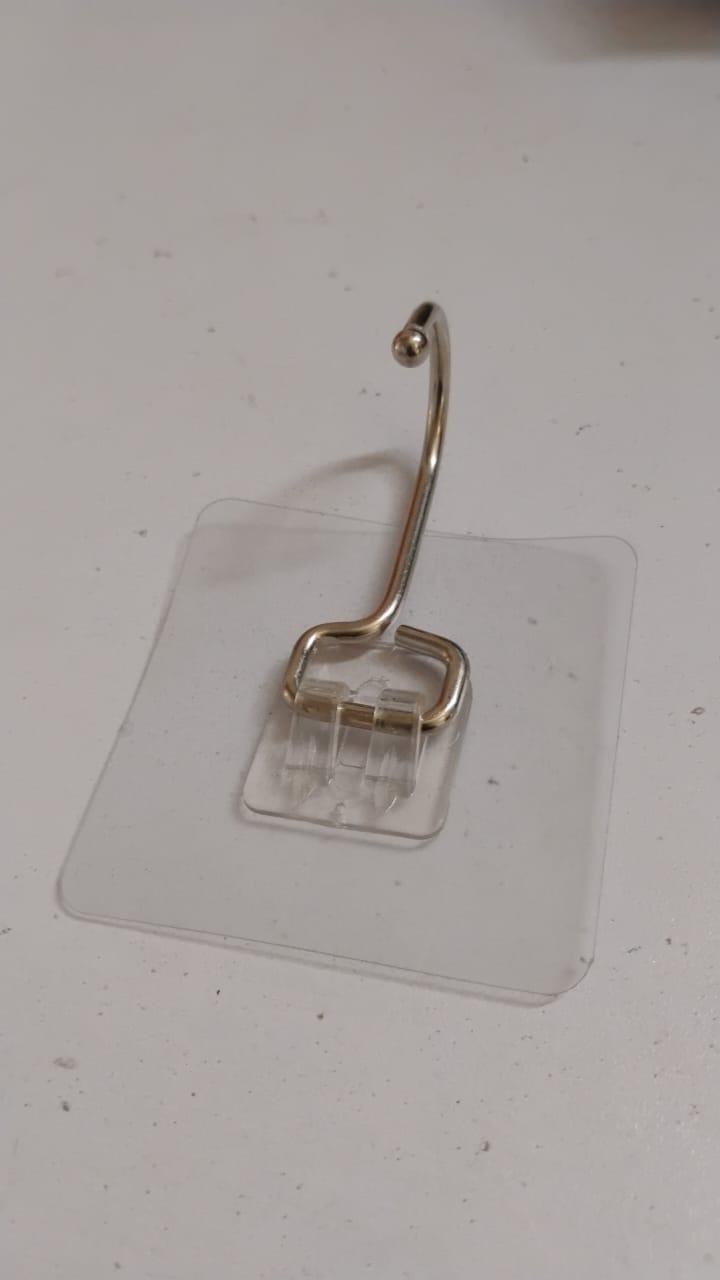 SteadyClear transparent adhesive wall hook holding towels and keys