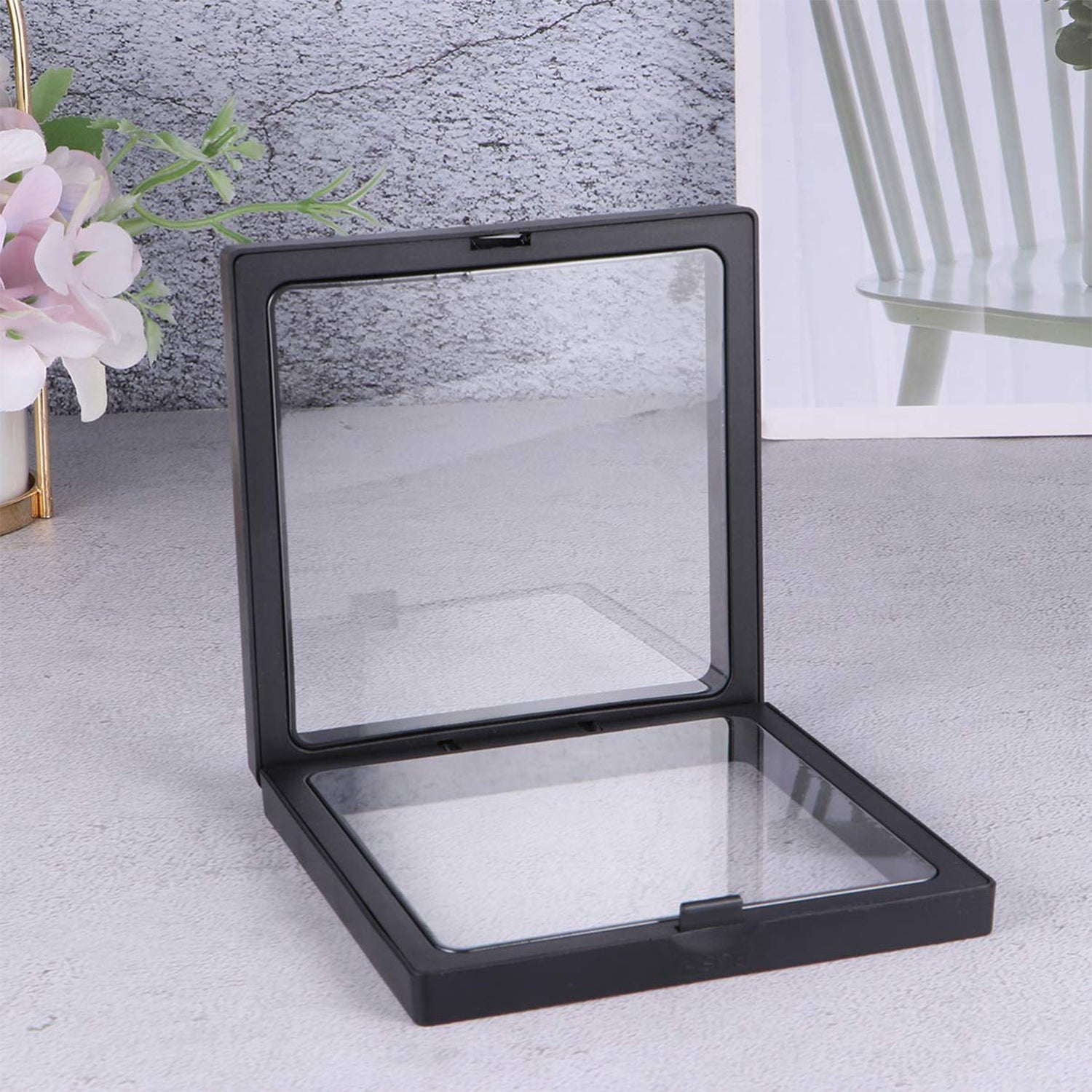 Side view of jewellery display frame showing clear floating effect