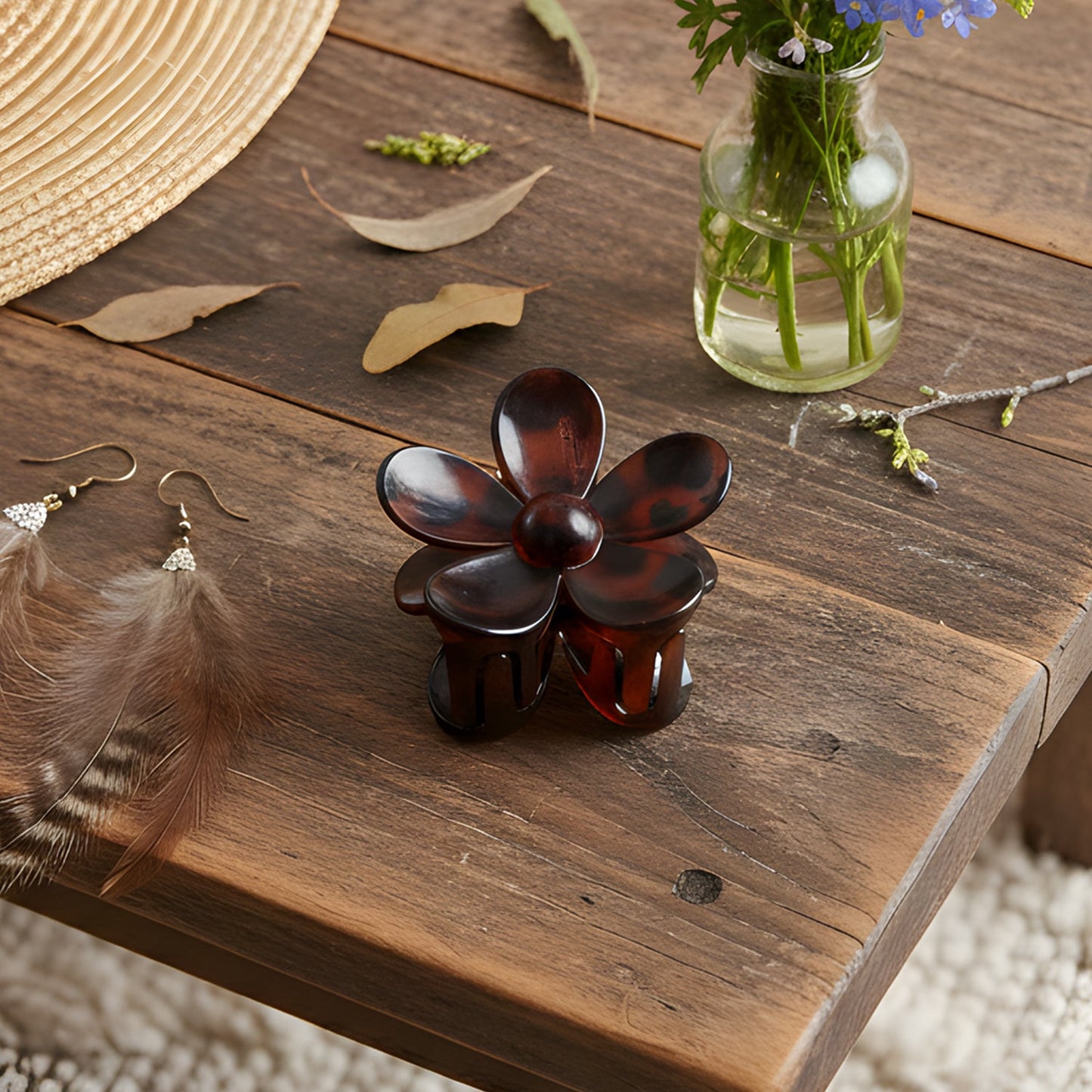 Hand holding lightweight flower hair clip showcasing size and design
