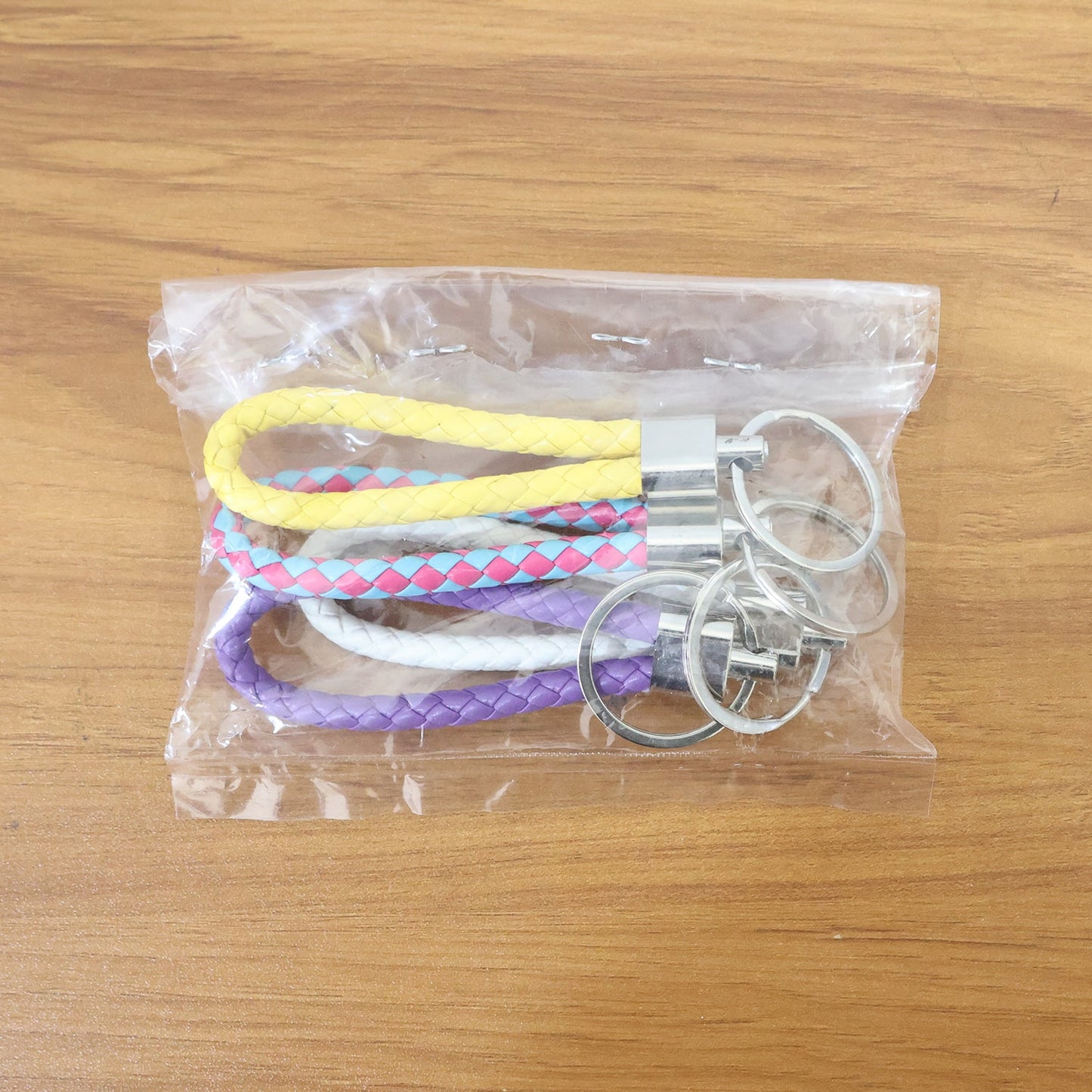 Detailed image of the secure metal ring on a braided loop keychain