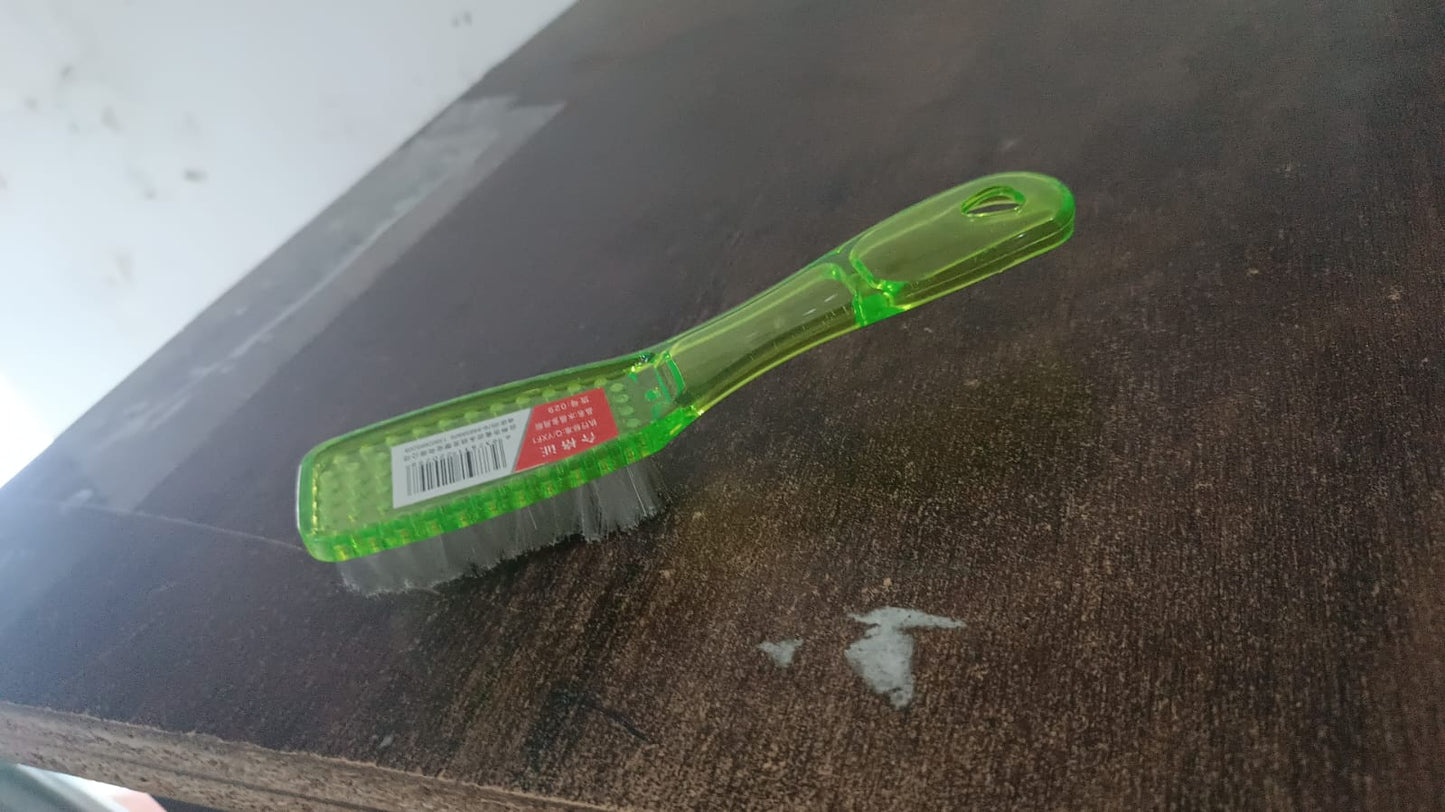 Durable scrubbing brush suitable for various household cleaning tasks.