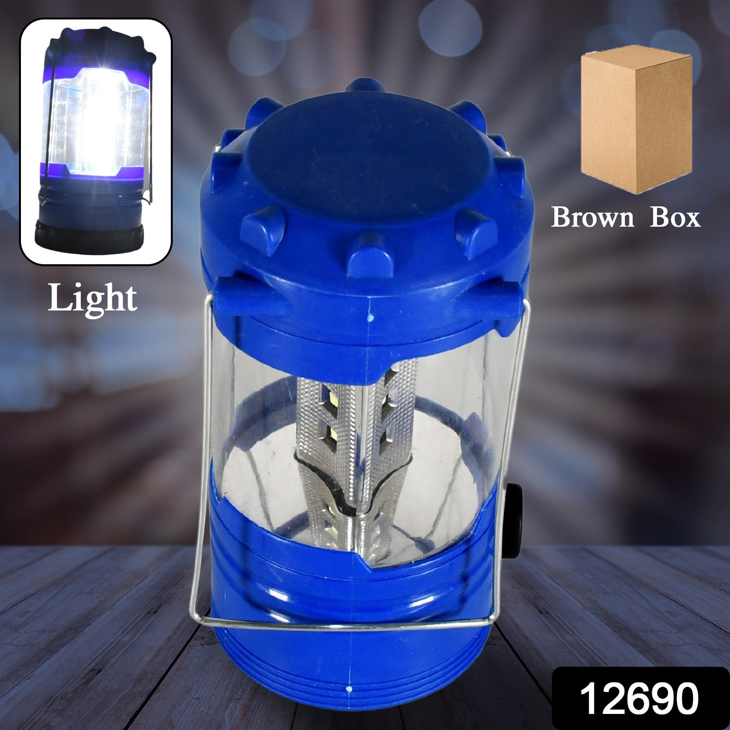 A blue and black LED lantern with a clear body and silver handles stands on a wooden surface.
