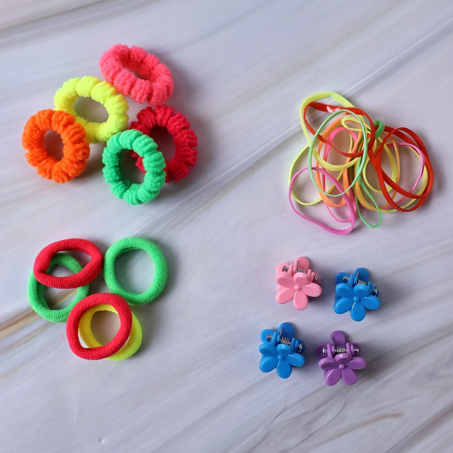 Variety of soft elastic hair bands in multiple colours perfect for kids' ponytails.