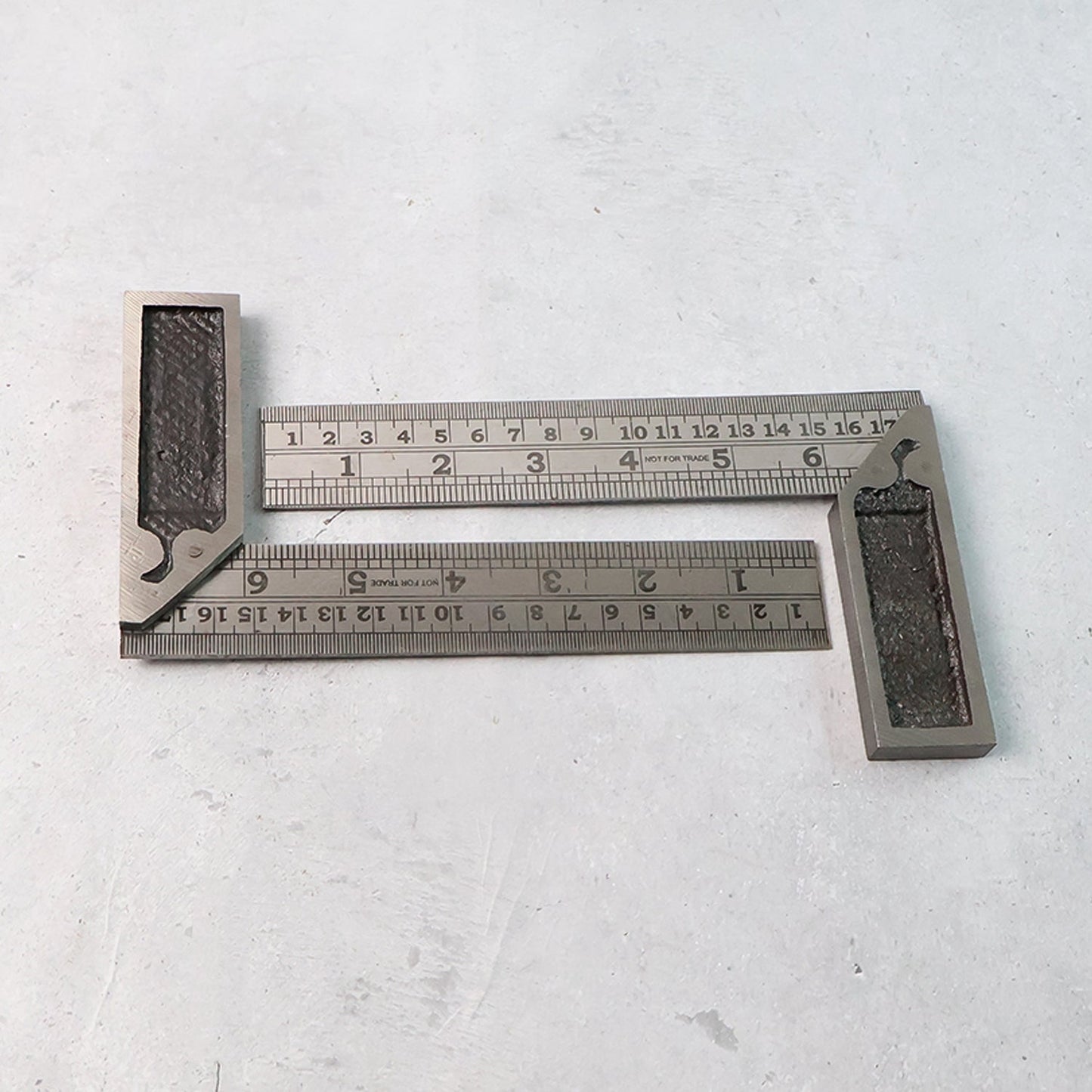 Two-piece metal try square ruler set showing accurate etched inch and centimeter measurements